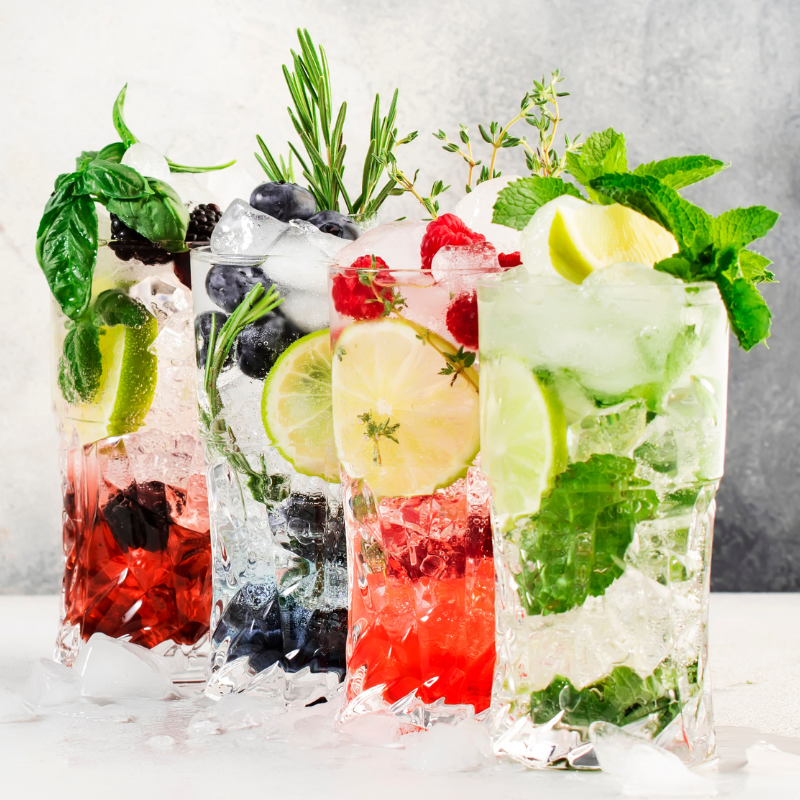 Four refreshing drinks with ice and fruit that showcase healthy, at-home beverage mixes.